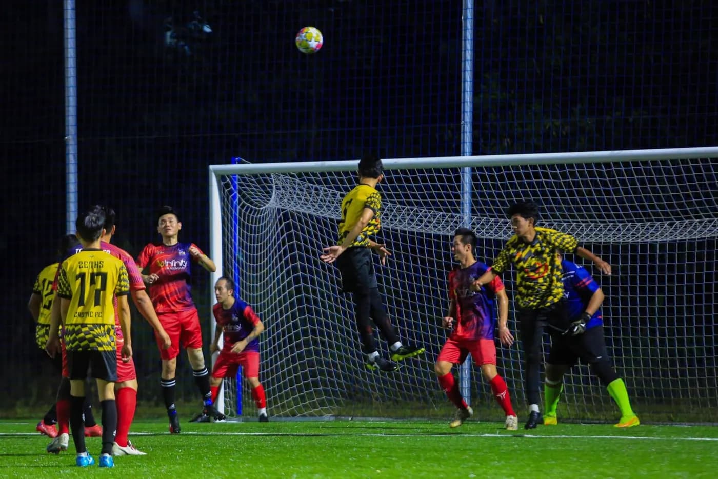 A player leaping to head the ball at ArmourX Sports