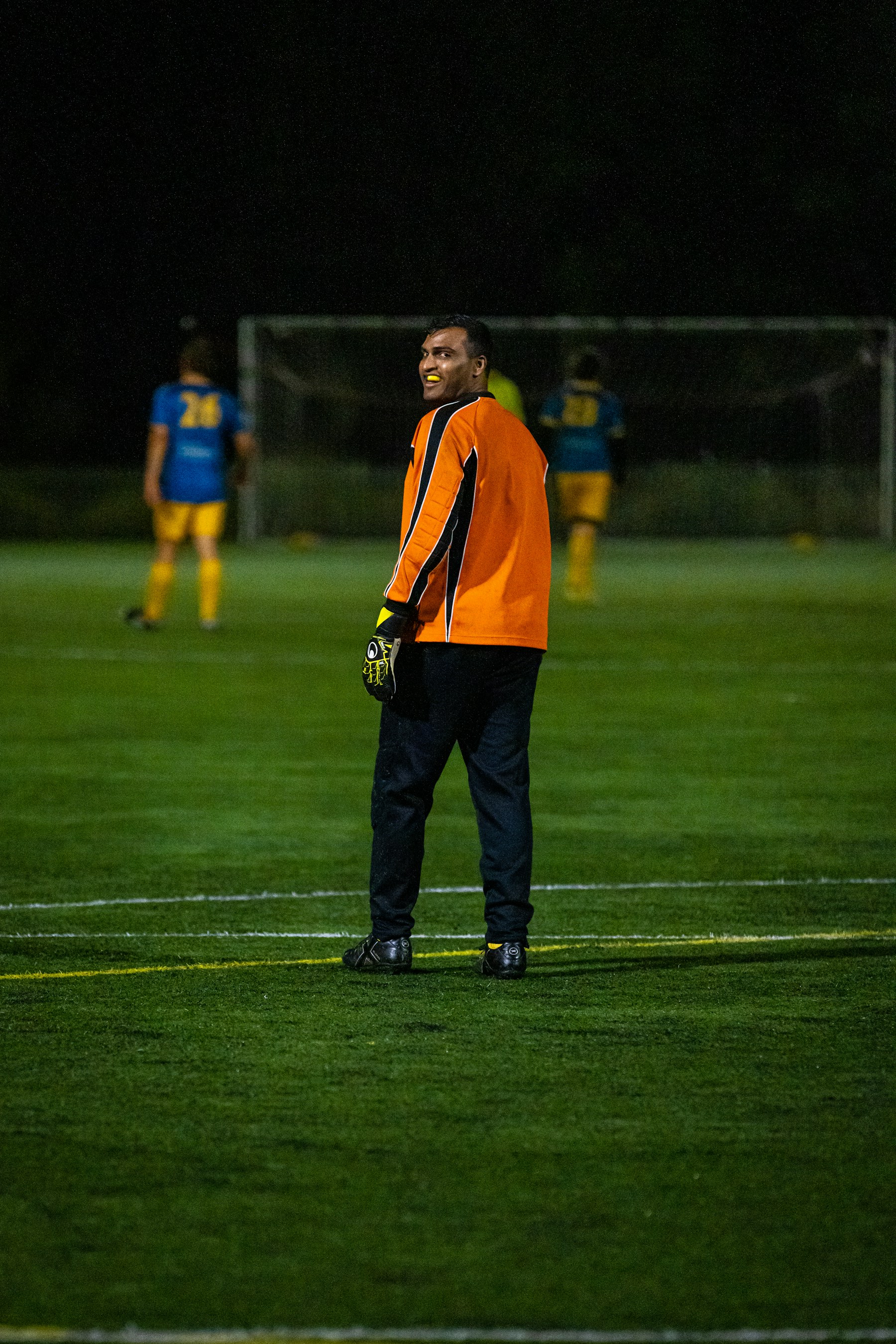 Football player on a field at night