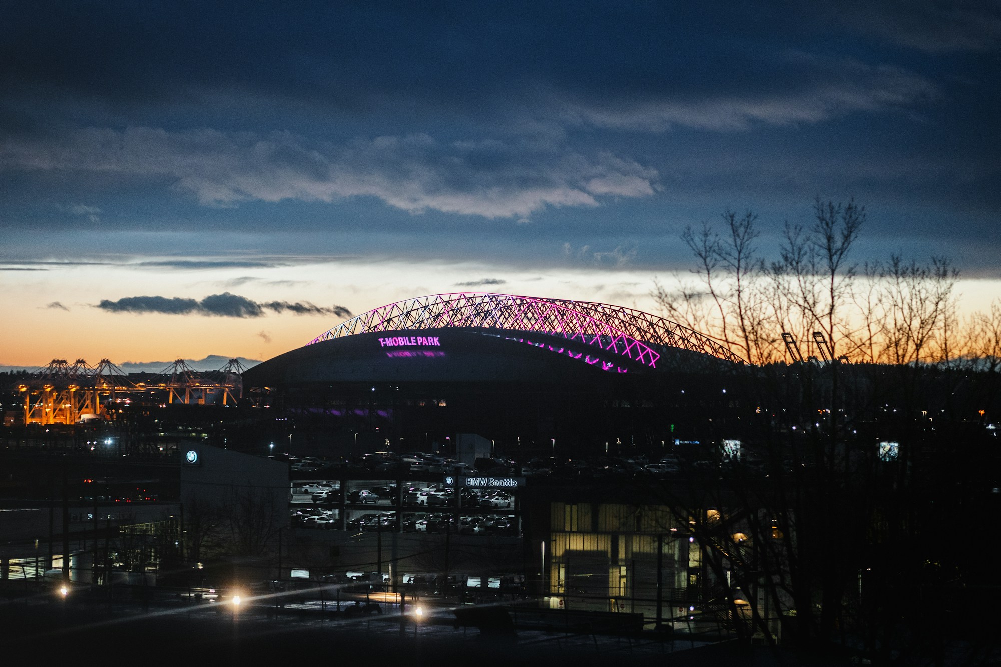 Floodlit stadium viewed from above at night